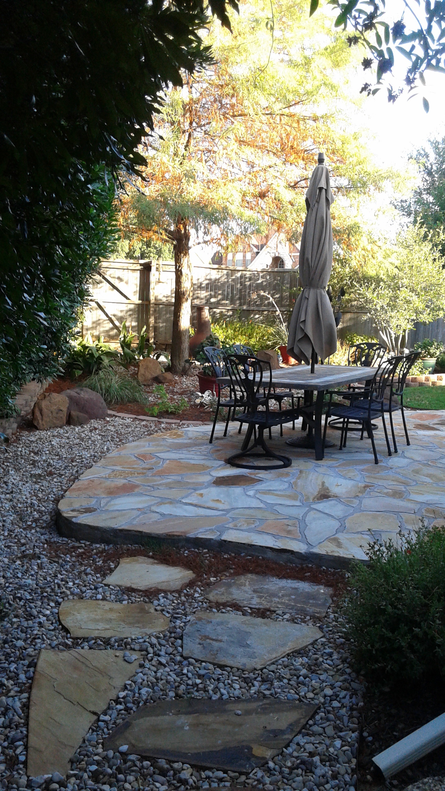 Custom stone patio by JC Landscaping